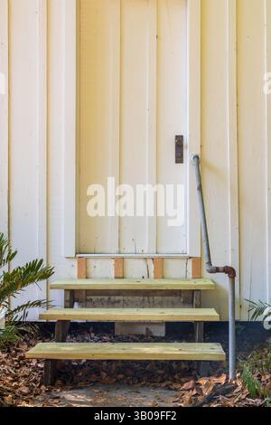 The front entrance of a historic 19th Century, former rural one room schoolhouse under restoration. Stock Photo