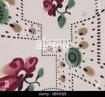 A close-up view of a floral fabric featuring vibrant red and green flowers alongside small brown and yellow dots, creating a charming and intricate pattern., A circular textile featuring a delicate floral pattern with vibrant pink flowers and green leaves, set against a light beige background adorned with small decorative elements. Classic art with a modern twist reimagined by Artotop, Transformed French Fabrics, First Half of the Nineteenth Century, Classic art with a modern twist reimagined by Artotop Stock Photo