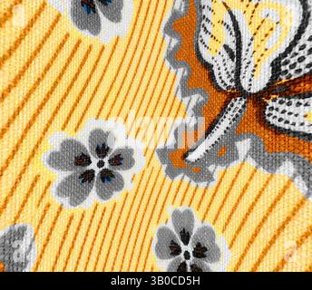 A vibrant textile featuring a striking pattern of gray flowers against a bright yellow background, accented by intricate details and wavy lines that create a dynamic visual appeal., A vibrant pattern featuring intricate floral designs in shades of orange, gray, and black against a bright yellow background, creating a lively and dynamic visual aesthetic. Classic art with a modern twist reimagined by Artotop, Transformed French Fabrics, First Half of the Nineteenth Century, Classic art with a modern twist reimagined by Artotop Stock Photo