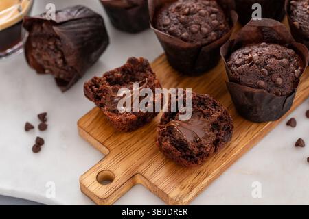 Chocolate chip muffins mini size with chocolate filling split in half, double chocolate muffins Stock Photo