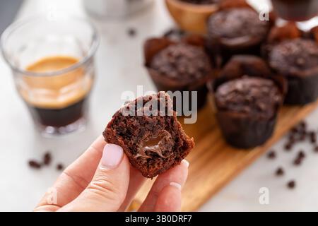 Chocolate chip muffins mini size with chocolate filling split in half, double chocolate muffins Stock Photo