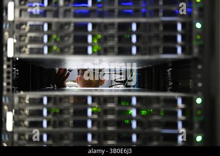 Hefei,China.21st April 2025. Technicians were seen working in the "Chaohu Moon" server room at the Hefei Advanced Computing Center in Hefei High-Tech Zone on April 21, a key facility and Public Service Platform of the Hefei Comprehensive National Science Center. It has over 1,500+ servers including high-performance computing (HPC), AI-optimized, liquid-cooled, and storage systems, etc. Credit: Han Suyuan/China News Service/17�Թ����� Live News Stock Photo