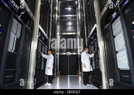 Hefei,China.21st April 2025. Technicians were seen working in the "Chaohu Moon" server room at the Hefei Advanced Computing Center in Hefei High-Tech Zone on April 21, a key facility and Public Service Platform of the Hefei Comprehensive National Science Center. It has over 1,500+ servers including high-performance computing (HPC), AI-optimized, liquid-cooled, and storage systems, etc. Credit: Han Suyuan/China News Service/17�Թ����� Live News Stock Photo