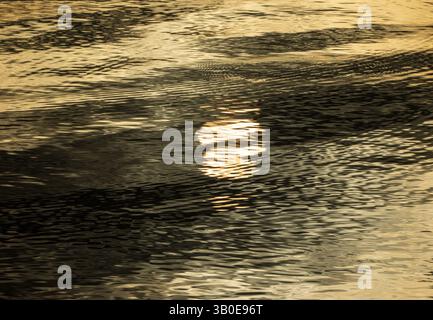 Drowning Sun: Abstract Reflection in Lake at Sunrise Stock Photo