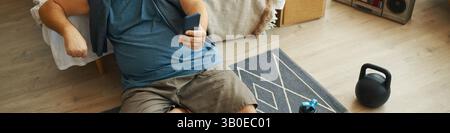 Relaxing at Home with Smartphone in Living Area Stock Photo