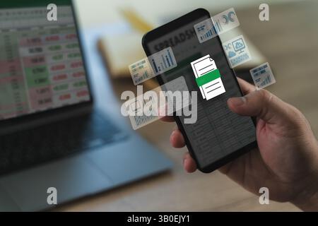A professional analyst uses digital software and spreadsheets to present finance data, charts, and reports in a modern workplace. Stock Photo
