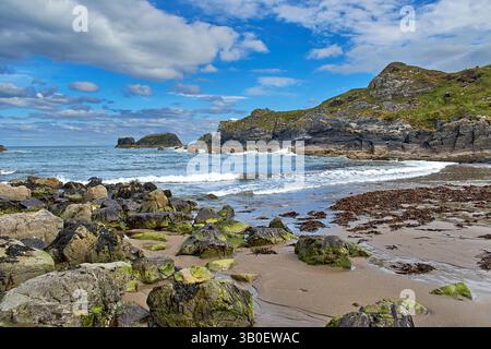 Salmon Howie Beach Macduff Aberdeenshire Scotland rocks and seaweed on the sandy beach Stock Photo