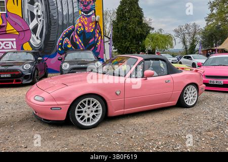 Mazda MX 5 pink car. Japanese 1990s classic convertible sports car