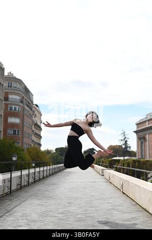 Beautiful ballerina dancing on street in the city Stock Photo