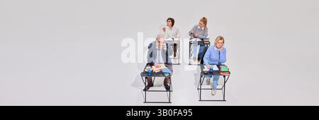 Elderly people, student sitting at desk with books and notes, elderly man and woman talking on phone, while two other women studying. Stock Photo