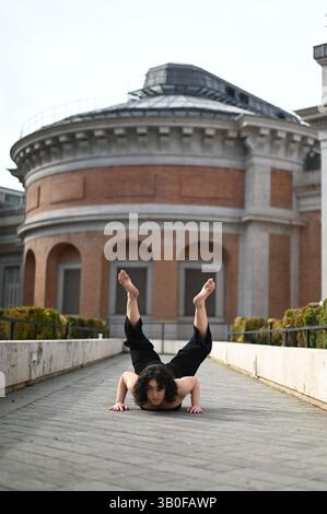 Beautiful ballerina dancing on street in the city Stock Photo