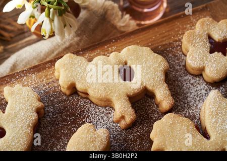 Linzer cookie in the shape of Easter lamb filled with red marmalade and dusted with sugar Stock Photo