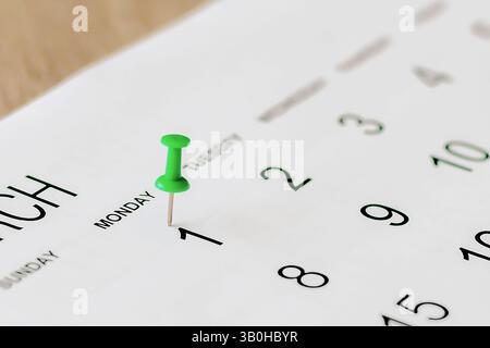 Embroidered pins on a calendar appointment Stock Photo