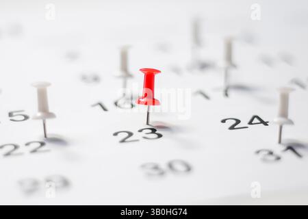 Embroidered pins on a calendar appointment appointment Stock Photo