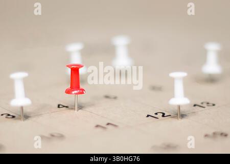 Embroidered pins on a calendar appointment appointment Stock Photo