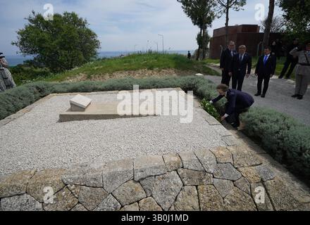 The Princess Royal, President of the Commonwealth War Graves Commission, at the grave in Sedd el Bahr of Lieutenant Colonel Charles Doughty-Wylie VC of the Royal Welch Fusiliers - who was posthumously awarded the Victoria Cross for service at Gallipoli - laying a wreath and card on behalf of King Charles III, Colonel-in-Chief of The Royal Welsh. Princess Anne is in Turkey to mark Anzac Day, which commemorates the anniversary of the start of the Gallipoli landings, and is a national day of remembrance for Australia and New Zealand. Picture date: Thursday April 24, 2025. Stock Photo