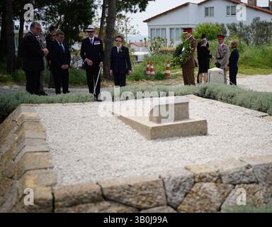 The Princess Royal, President of the Commonwealth War Graves Commission, and Vice Admiral Sir Tim Laurence at the grave in Sedd el Bahr of Lieutenant Colonel Charles Doughty-Wylie VC of the Royal Welch Fusiliers - who was posthumously awarded the Victoria Cross for service at Gallipoli - laying a wreath and card on behalf of King Charles III, Colonel-in-Chief of The Royal Welsh. Princess Anne is in Turkey to mark Anzac Day, which commemorates the anniversary of the start of the Gallipoli landings, and is a national day of remembrance for Australia and New Zealand. Picture date: Thursday April  Stock Photo