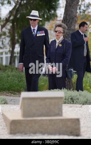 The Princess Royal, President of the Commonwealth War Graves Commission, and Vice Admiral Sir Tim Laurence at the grave in Sedd el Bahr of Lieutenant Colonel Charles Doughty-Wylie VC of the Royal Welch Fusiliers - who was posthumously awarded the Victoria Cross for service at Gallipoli - laying a wreath and card on behalf of King Charles III, Colonel-in-Chief of The Royal Welsh. Princess Anne is in Turkey to mark Anzac Day, which commemorates the anniversary of the start of the Gallipoli landings, and is a national day of remembrance for Australia and New Zealand. Picture date: Thursday April  Stock Photo