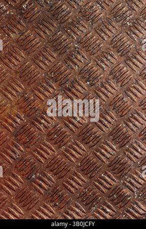 Rusty steel checker plate grunge background. Rusty aged industrial material concept Stock Photo