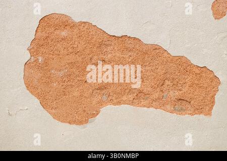 Exposed Brick Wall Under Peeling Plaster Stock Photo
