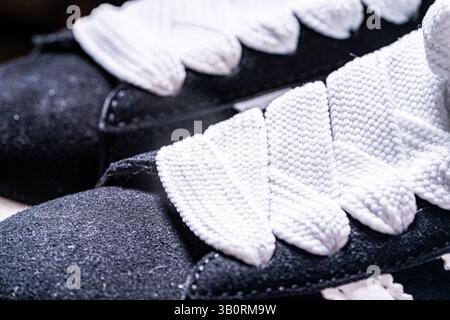 Black sneakers with white laces. Close-up. High quality photo Stock Photo
