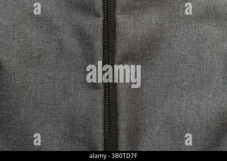 Gray fabric bag with zipper close-up, pocket with zipper on backpack Stock Photo