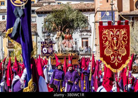 The Paso Oración en el Huerto de San Antón of the Venerable Hermandad de Nuestro Padre Jesús Orando en el Huerto (San Antón) shows Jesus praying in the Garden of Gethsemane, accompanied by an angel, and symbolises the beginning of the Passion of Christ at the Maundy Thursday procession in Cuenca. Calle San Lázaro, Cuenca, Castilla-La Mancha, Spain Stock Photo