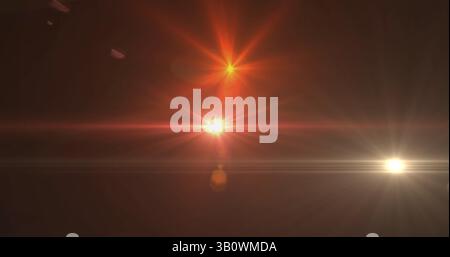 Image of glowing spots of lights over dark background Stock Photo
