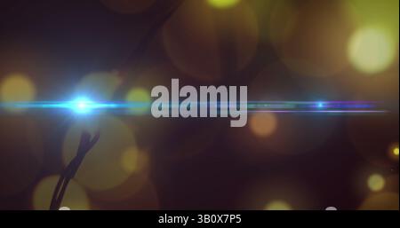 Image of glowing blue light over yellow light spots Stock Photo