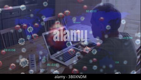 Working elderly man using laptop at home dining table, with papers and virus overlay, copy space Stock Photo