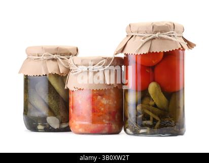 Many jars with different pickled products isolated on white Stock Photo