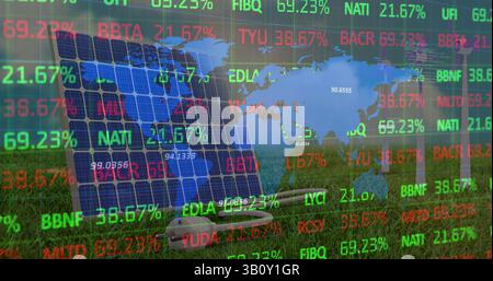 Image of financial data processing and world map over wind turbines and solar panel Stock Photo