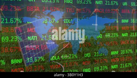 Image of financial data processing and world map over wind turbines and solar panel Stock Photo