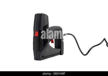 Black electric stapler with red button on top. Stapler with cord on white background. Stock Photo