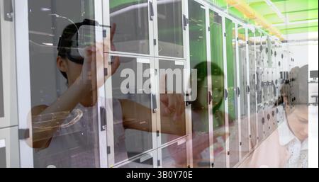 Image of server room over biracial girl using vr headset Stock Photo
