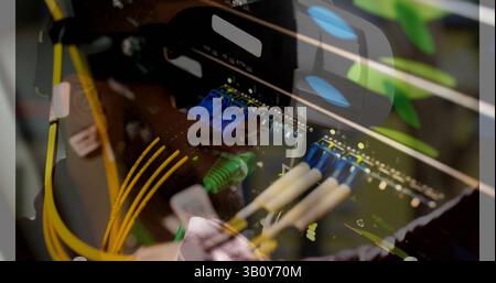 Image of server room over biracial man using vr headset Stock Photo
