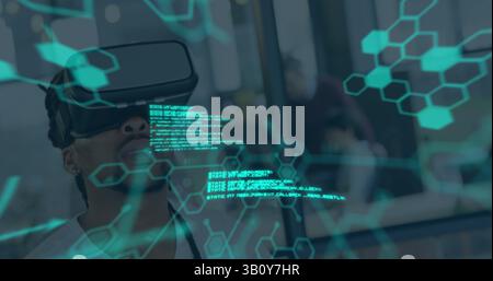 Image of data processing over biracial man using vr headset Stock Photo