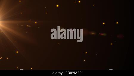 Image of yellow dots floating on black background Stock Photo