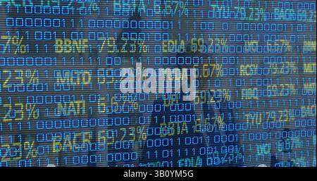 Image of financial data over businesspeople and binary code Stock Photo