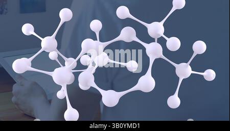 Image of molecules over caucasian man using tablet Stock Photo