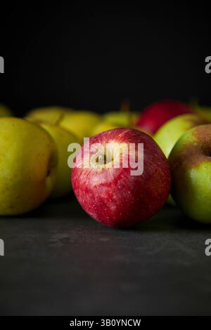 Red and Green Apples on Dark Background Stock Photo