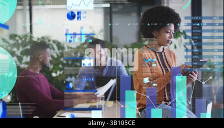 Statistical data processing against thoughtful african american woman using digital tablet at office Stock Photo