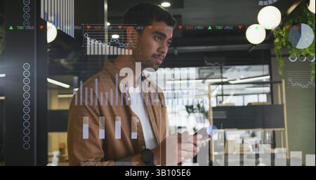 Stock market and statistical data processing against hispanic man using smartphone at office Stock Photo