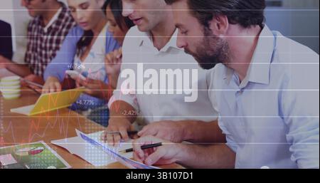 Statistical data processing against two caucasian men discussing at office Stock Photo
