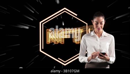 Image of nft in hexagon over caucasian woman using smartphone on black background with lines Stock Photo
