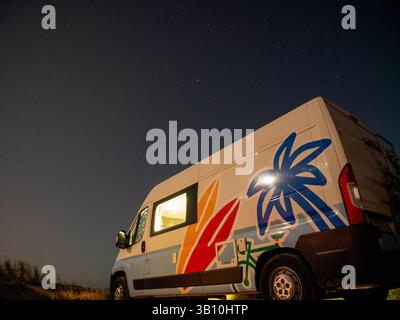 Camper van under starry sky Stock Photo - Alamy