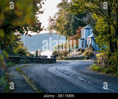 A Winding Road Through A Scottish Village In The Borders On A Foggy Morning Stock Photo
