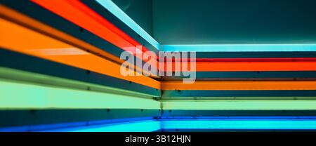 Colorful glowing LED neon lights on wall Stock Photo