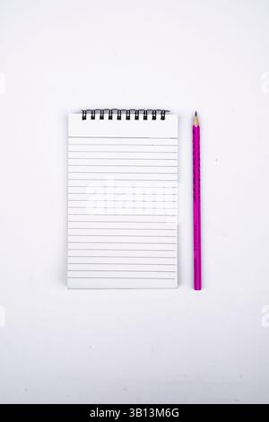 Simple and professional photo featuring an open blank diary with a pencil, symbolizing thoughts, memories, and fresh starts. Great for content on jour Stock Photo