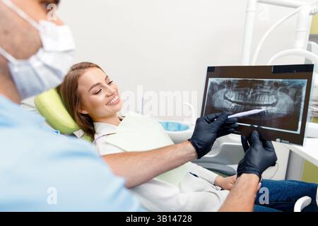 x-ray dentist, Smiling dentist, Showing X-ray dentist, male doctor examining, dentist showing, medical dentist center, consultation dental clinic Stock Photo